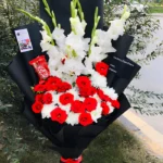 Beautiful flower sorry gift with red roses and white lilies for apology delivery in Pakistan